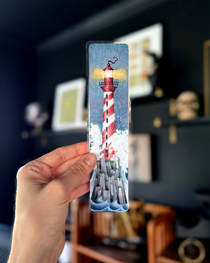 Photo of hand holding a lighthouse bookmark 